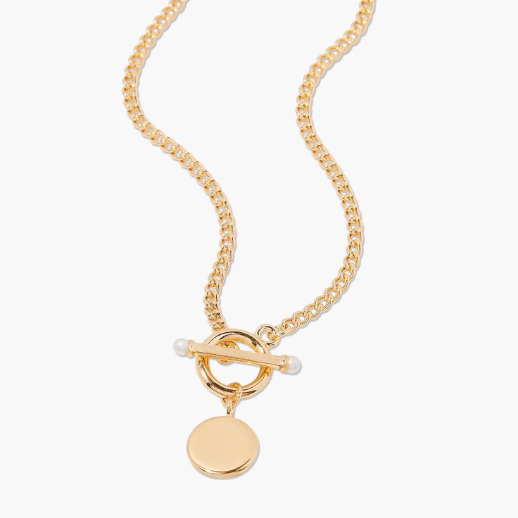 Inspired by preppy classics, the Stella Pearl Toggle Necklace is an engravable necklace that combines several of our favorite details. The pearl accented toggle is a stylish way to keep this necklace secure and the pendant can be personalized with either your initials or your monogram in your choice of engraving styles. Available in 14k gold plated, rhodium plated or 14k rose gold plated brass Pendant size: 1/2" 18" curb chain Simulated 3mm pearl Toggle closure With engraving this item is FINAL Engravable Necklace, Tennis Jewelry, Toggle Necklace, Great Gifts For Mom, Engraved Necklace, Brass Pendant, The Pearl, Curb Chain, Silver Rose Gold