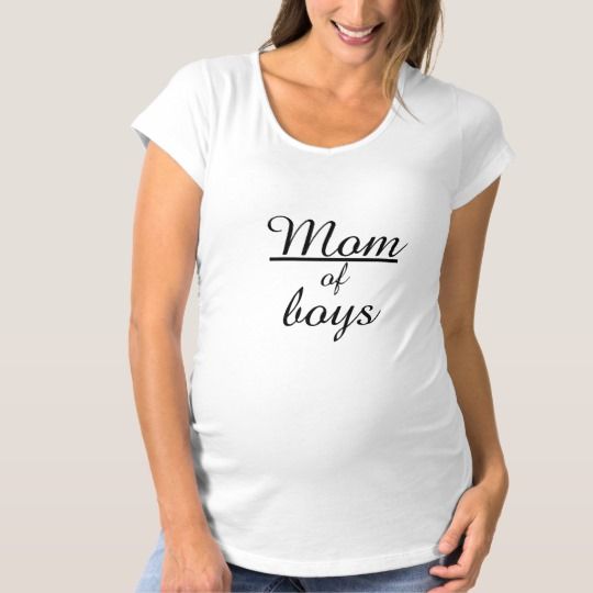 a pregnant woman wearing a white t - shirt with pink writing on it