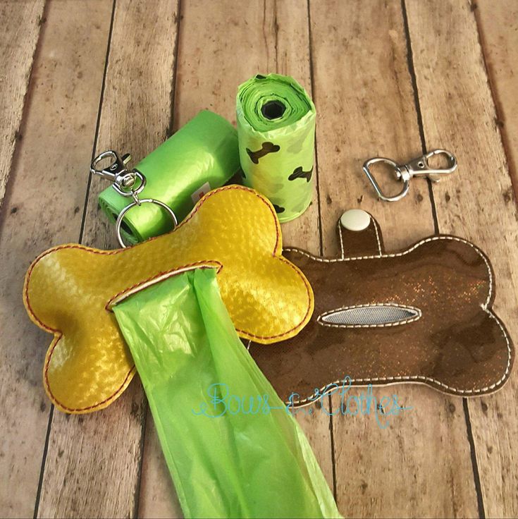 a pair of scissors and other items sitting on a wooden floor next to each other