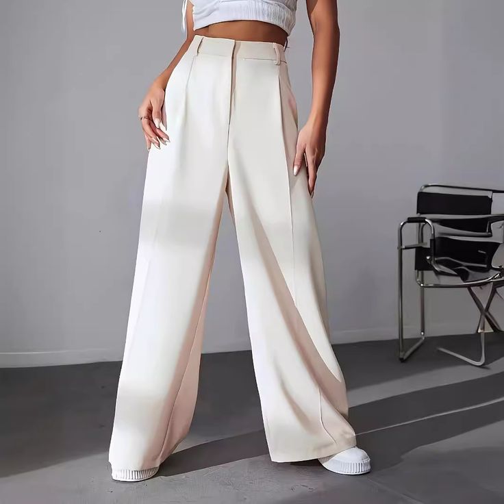 Elevate your professional wardrobe with our Wide Leg High Waist Loose Dropping Work Pants for Women. These stylish pants are designed to provide both comfort and sophistication, making them the perfect choice for the office or business meetings. The high waist design offers a flattering silhouette that cinches at the waist, creating a slim and elongated appearance that enhances your natural curves.Crafted from high-quality materials, these pants feature a relaxed fit that allows for unrestricted movement throughout your busy day. The wide leg design adds a touch of elegance while ensuring you stay comfortable and stylish. These versatile pants can be dressed up or down, making them a staple piece for any woman's wardrobe. Whether you're pairing them with a tailored blouse for a polished lo Work Pants Women, Trendy Pants, Sequin Pants, Costume Intero, Baggy Pants, Baggy Pant, Pantalon Large, Fitted Trousers, Women Pants Casual