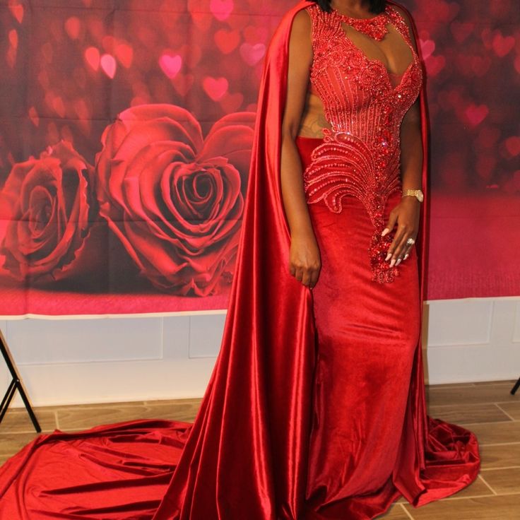 Steal The Show With This Red Custom Gown With Train Cape Red Gown With Cape, Luxury Red Evening Dress, Red Luxury Gown For Gala, Luxury Red Evening Dress For Prom, Luxury Red Prom Evening Dress, Luxury Red Gown For Formal Events, Luxury Red Gown For Formal Occasions, Red Evening Dress With Sweep Train For Red Carpet, Red Floor-length Evening Dress For Red Carpet