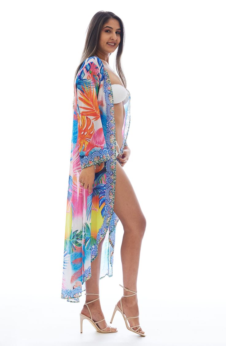 Charm your festival or beach look with this lightweight duster covered in a vibrant flamingo pattern. Open front Kimono-inspired sleeves
 100% polyester
 Hand wash cold, lay flat to dry
 Imported Model stats: 5'10", 32" bust, 25" waist, 36" hip. Model is wearing size One Size. Trendy Multicolor Beach Cover-up, Tropical Long Sleeve Cover-up For Beach Season, Spring Long Pool Cover-up, Long Spring Pool Cover-up, Spring Long Sleeve Pool Cover-up, Long Printed Vacation Cover-up, Multicolor Hawaiian Cover-up With Tropical Print, Multicolor Beachwear Kimono For Beach Party, Multicolor Palm Tree Print Swimwear For Spring