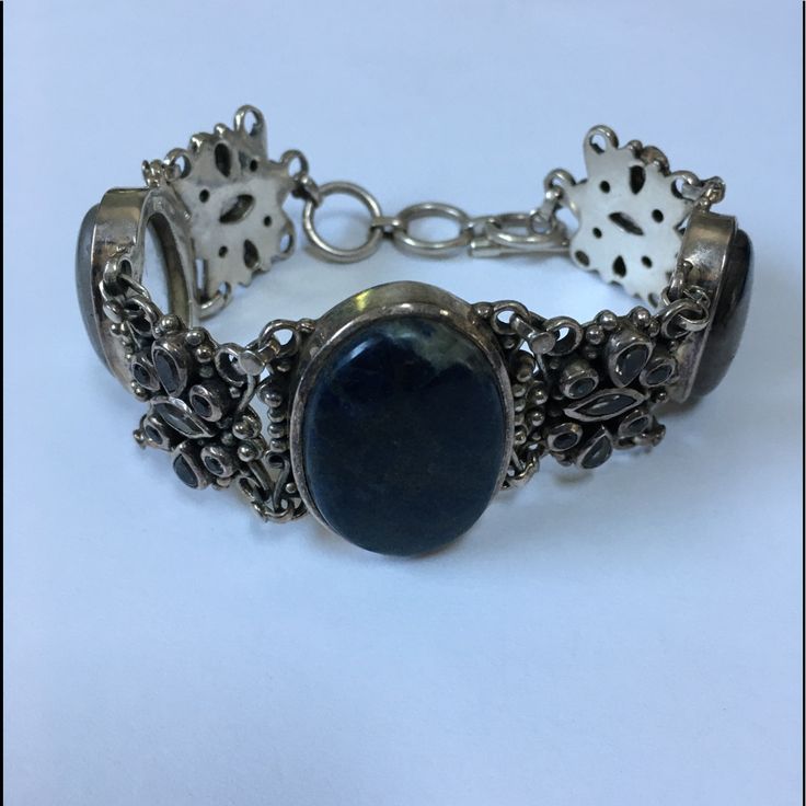 This Bracelet Is Filled With Gemstone Treasures. A Large Agate In The Center, Two Rutialted Quartz On The Sides And Variety Of Stones Used In The Design Separating The Main Stones. The Toggle Clasp Makes To Adjustable From 7 1/4” To 9”. The Total Weight On This Piece Is Am Amazing 97.2g Or 3.43oz. As With All My Listings, Unless Otherwise Stated, This Is New Never. Thank You For Your Interest. Elegant Multi-stone Healing Jewelry, Adjustable Moss Agate Gemstone Jewelry, Adjustable Sterling Silver Bracelet With Natural Stones, Elegant Agate Gemstone Bracelets, Elegant Agate Bracelet With Natural Stones, Elegant Agate Bracelets With Natural Stones, Elegant Bracelets With Natural Agate Stones, Lapis Lazuli Bracelet With Natural Stones, Agate Gemstone Bracelet Jewelry