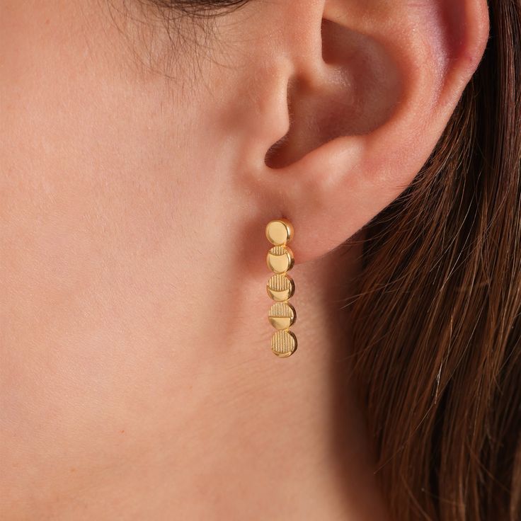 Moon phases two-piece earrings feature a series of meticulously detailed charms representing the different phases of the moon. The moon phase charms are gracefully arranged, creating an elegant and celestial design that captures the beauty of the lunar cycle. The earrings are designed as studs, offering versatility in styling..  𝗠𝗔𝗧𝗘𝗥𝗜𝗔𝗟: 925 Silver -18 K Gold Vermeil Long-lasting gold gezil is a thick layer of solid 18kt gold covering 925 Sterling Silver Stud Earrings Our prices are the lowest you will find anywhere because we produce unique designs with independent workshops led by women and local artisans from Turkey. Our Packaging is created from recycled sources and 100% recyclable. 925 Sterling Silver, 14 K Gold Vermeil The best way to clean is to wipe it clean with a moist c Minimalist Moon Charm Drop Earrings, Minimalist Yellow Gold Earrings With Moon Charm, Dainty Half Moon Charm Earrings, Dainty Half Moon Earrings With Moon Charm, Dainty Moon Phase Earrings, Elegant Half Moon Metal Earrings, Gold Moon Phase Earrings, Elegant Gold Plated Moon-shaped Earrings, Elegant Gold Earrings With Moon Charm