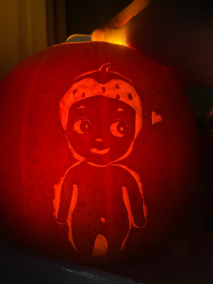 a pumpkin carved to look like a cartoon character