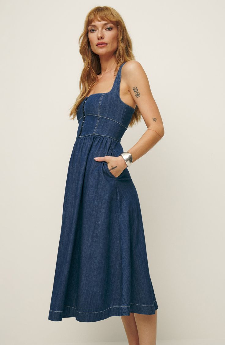 A hook-and-eye bodice lends nostalgic charm to a denim dress made from a modern mix of organic and recycled cotton. 46" length (size 8) Front hook-and-eye closure Square neck Partially lined 80% organic cotton, 20% recycled cotton Machine wash, tumble dry Made in Turkey Indigo Midi-length Cotton Denim Dress, Indigo Midi Length Cotton Denim Dress, Indigo Denim Midi Dress, Indigo Cotton Denim Midi Dress, Indigo Cotton Midi Length Denim Dress, Square Neck Medium Wash Denim Dress For Summer, Summer Denim Square Neck Dress, Square Neck Denim Summer Dress, Summer Denim Dress With Square Neck