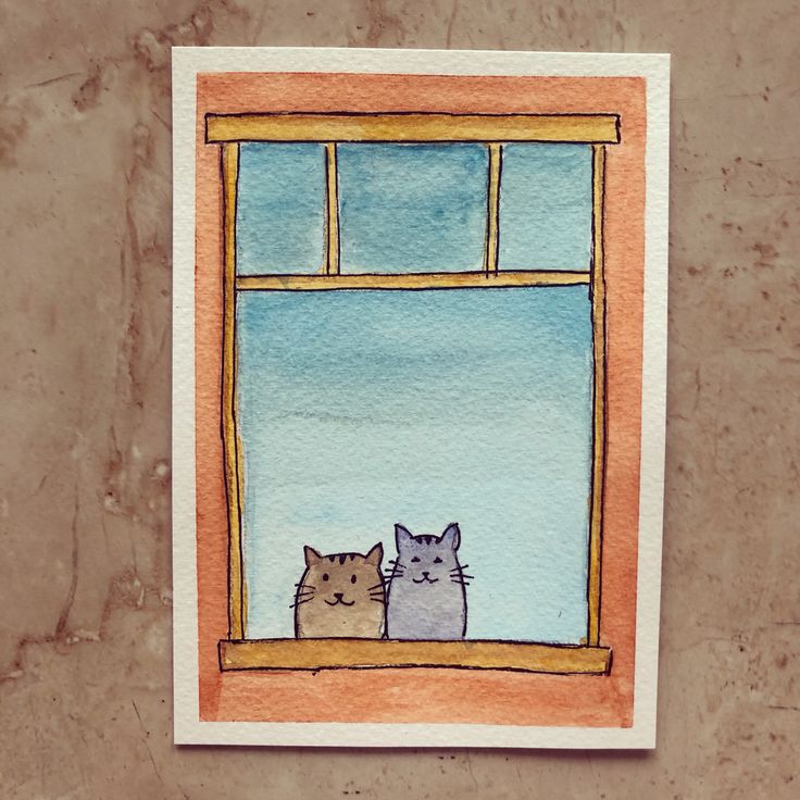 two cats are sitting in the window sill looking out at the snow and sky