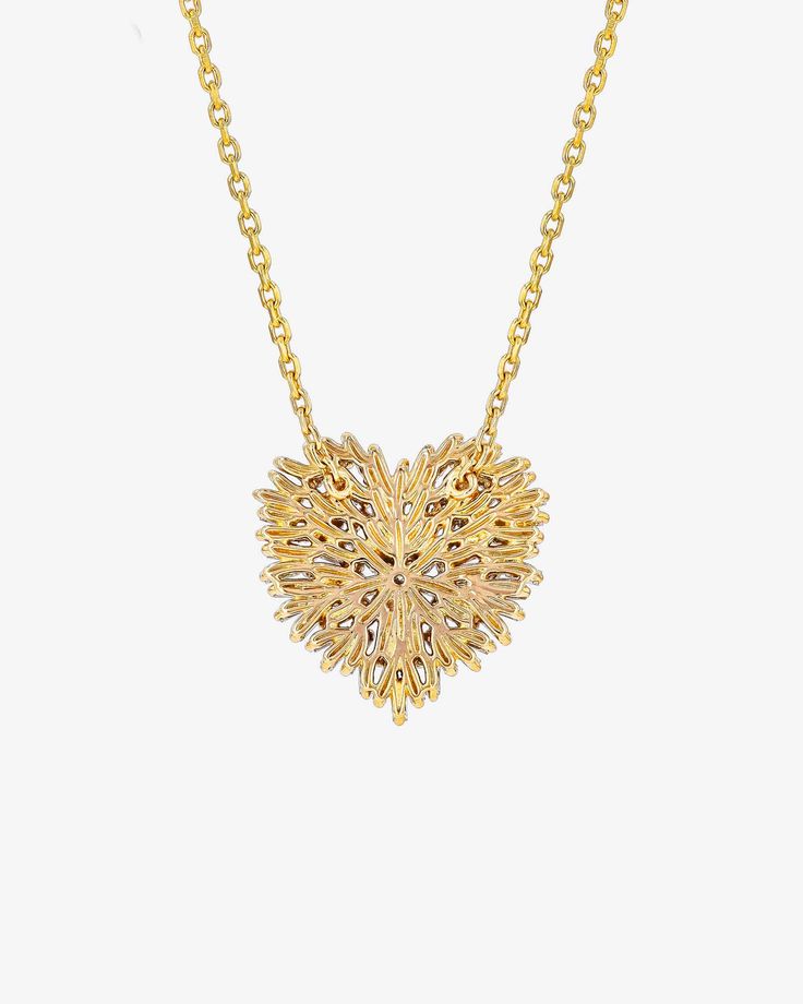 Suzanne loves taking classic design motifs and modernizing them using here 'Fireworks' setting. This Classic Diamond Medium Heart Necklace is one of them. Baguette diamonds uniquely scattered to create the everyday heart pendant. Details 18k yellow gold, rose gold or white gold 1.02 carats of baguette and round white diamonds Necklace length 18 inches and can be adjusted to 16 inches 19x19mm dimensions Ref: BAP384 Luxury Heart Necklace For Wedding, Elegant Necklaces With Intricate Design For Valentine's Day, Luxury Heart Shaped Jewelry For Evening, Luxury Heart Pendant Necklace, Elegant Heart Cut Baguette Diamond Jewelry, Elegant Filigree Necklaces For Valentine's Day, Luxury Diamond Heart Necklace In Yellow Gold, Elegant Filigree Heart Necklace, Gold Heart Necklace For Evening