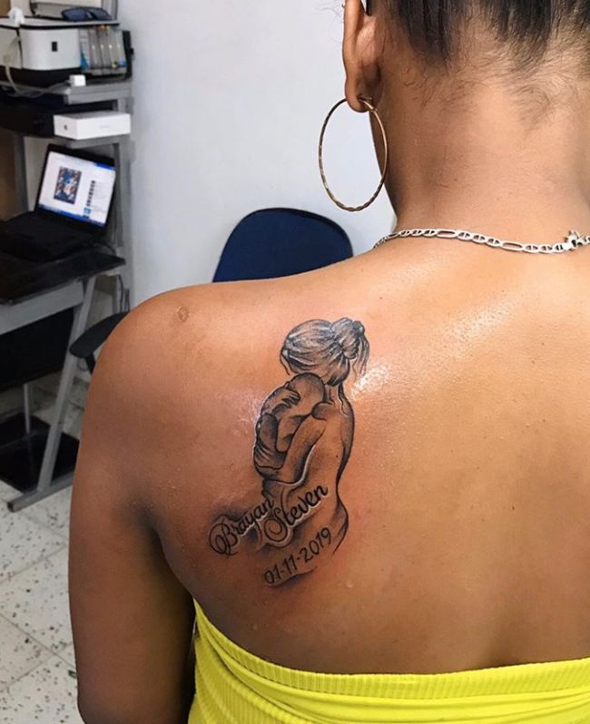 a woman with a tattoo on her back