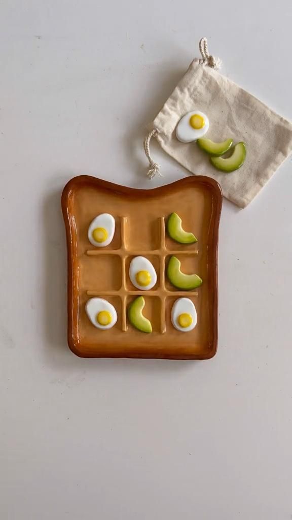 an egg and avocado on a plate next to a small bag with some kind of food in it