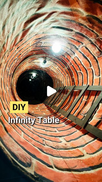 the inside of a brick tunnel that is being worked on by a man with scissors