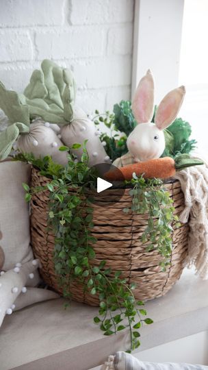 a basket filled with plants and stuffed animals