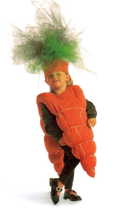 a young child dressed in a carrot costume with green hair and black leggings