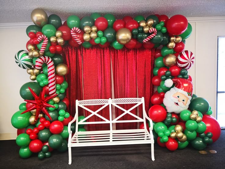 a decorated stage with balloons and christmas decorations