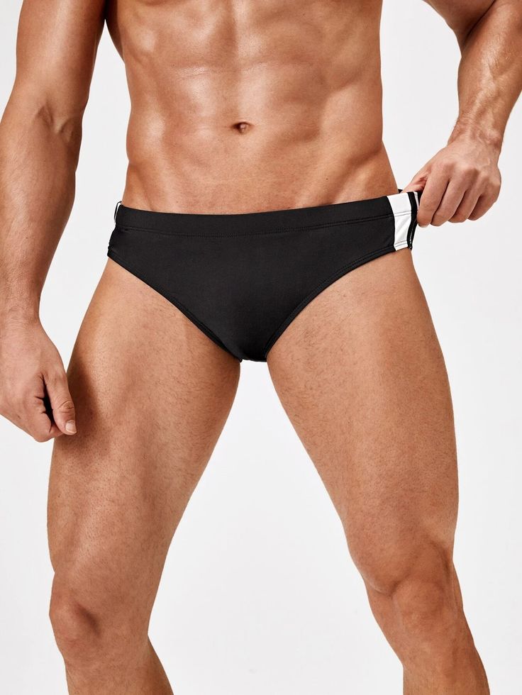 Elevate your swimwear collection with our Contrast Striped Panel Swim Brief. These swimwear bottoms boast a sleek design with contrasting panels that add a modern and stylish touch. Crafted from high-quality materials, they offer a comfortable and supportive fit, allowing you to move with confidence in the water. Features: Pattern Type: Striped Type: Briefs Fabric: High Stretch Material: Fabric Composition: 82% Polyester, 18% Spandex Size Chart ( Inches ): Size Length Waist Size S 10.5 28.3 M 11 Sporty Swimwear With Contrast Trim For Poolside, Sporty Black Swimwear With Contrast Trim, Black Sporty Swimwear With Contrast Trim, Sporty Stretch Swimwear Briefs, Stretch Swimwear With Contrast Trim For Poolside, Sporty Swimwear Briefs For Swimming, Sporty Brief Swimwear For Swimming, Sporty Brief Swimwear, Sporty Contrast Color Swimwear For Pool