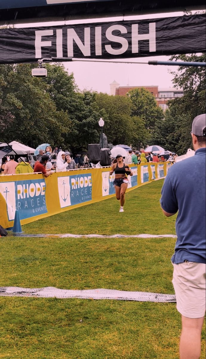 people are running on the grass at a race