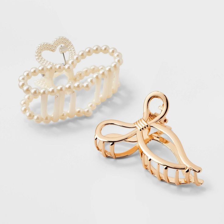 Enhance your kid's style with the Girls' 2pk Heart and Bow Claw Clip Set from art class™. These gold and pearl clips, featuring adorable heart and bow designs complement all hair types. Ideal for ages 3 and up, these versatile accessories enhance the look to any outfit. Elevate her look with these charming heart and bow hair clips from art class, perfect for daily wear or special occasions. Art Class™: One-of-a-kind looks for the one and only you Bow Claw Clip, Pearl Clips, Outfit Info, Bow Designs, Christmas Inspo, Knitted Romper, Bow Design, Gold Hair, Bow Hair