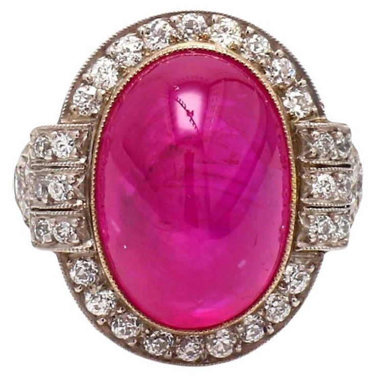 Platinum and 18K yellow gold, cocktail ring. Center stone is one (1) oval, pyramidal cabochon cut ruby weighing 15.25ct. Ruby is accompanied by AGL Prestige Gemstone Report #CS1076454. Ring is set with thirty-six (36) round brilliant cut diamonds weighing approximately 0.75ctw. Ring weighs 9.3 grams and is a size 6. All questions answered. All reasonable offers are considered! Antique Cocktail Ring, Yellow Gold Cocktail Ring, Sapphire Cocktail Ring, Green Emerald Ring, Vintage Cocktail Ring, Platinum Diamond Rings, Emerald Diamond Ring, Gold Cocktail Ring, Gold Cocktail