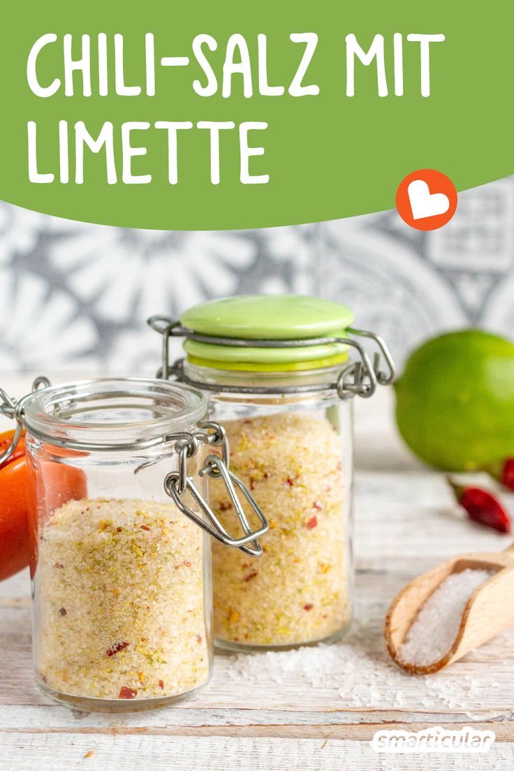 two jars filled with food sitting on top of a table