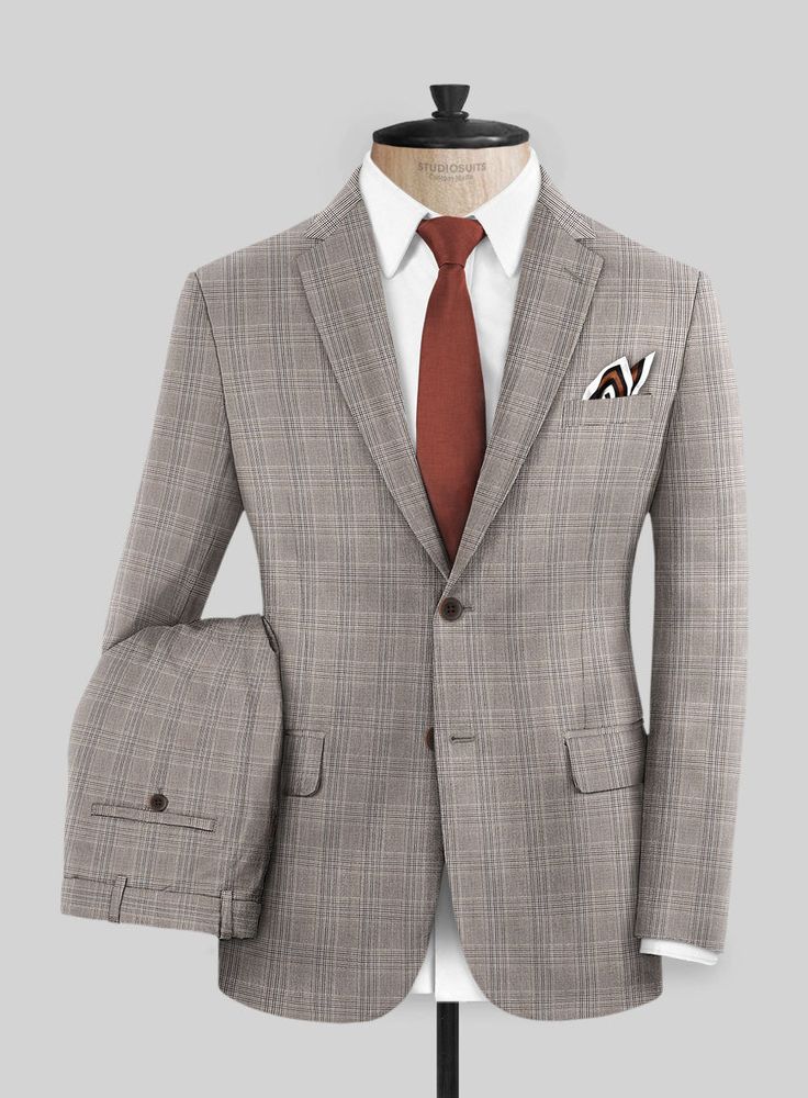 Stand out at premium events and weddings with our Napoleon Brown Glen Suit, which will give you a trendy look. Crafted from a wool blend fabric, the classy plaid design in brown shade ensures comfort and confidence. So offer an instant sophisticated look with our elegant suit that puts you in the limelight. 
 
 Look Includes   Napolean Brown Glen  Fabric  Two Button Jacket Style  Notch Lapel  Horn Brown Buttons  Single Vent  Three Cuff Buttons  Two Welted Back Pockets on Trousers   You can chang Elegant Suit, Brown Shade, Button Jacket, Brown Shades, Plaid Design, Jacket Buttons, Jacket Style, Horn, Wool Blend