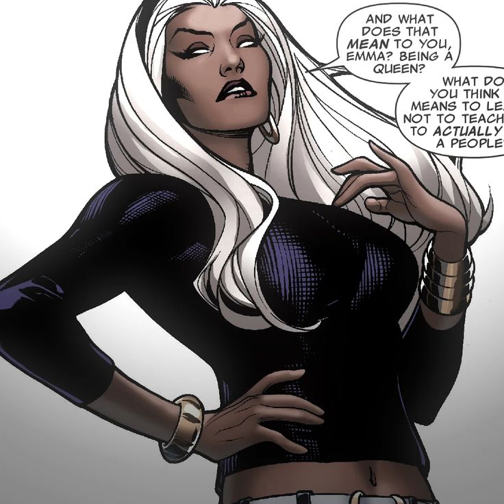 an image of a woman with white hair and black top holding her hands on her hips