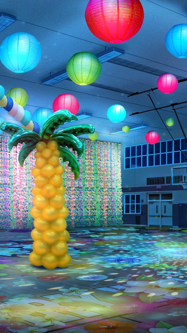 there is a palm tree in the center of this room with many lanterns hanging from the ceiling