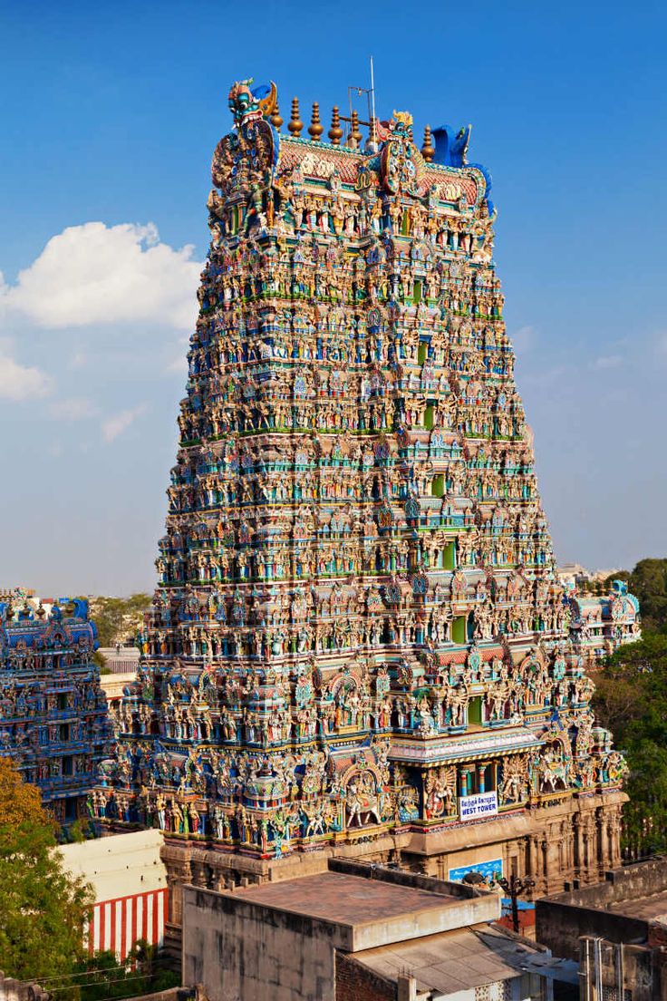 an elaborately decorated tower in the middle of a city