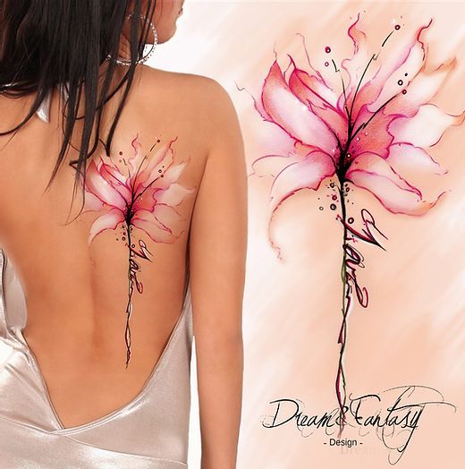 the back of a woman's body with pink flowers painted on her upper and lower back