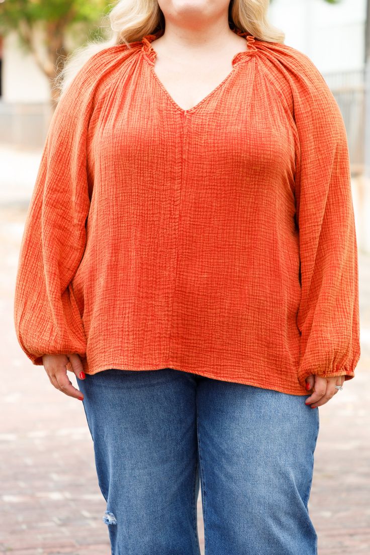 This top would look awesome in your wardrobe! Crafted in a bold rust color, the top's textured design and relaxed fit give it a subtle edge while still maintaining classic chic vibes! Pair it with distressed denim and booties for effortless style! 100% Viscose Chic Tops With Frayed Hem And Relaxed Fit, Chic Relaxed Fit Top With Frayed Hem, Chic Long Sleeve Tops With Frayed Hem, Casual Textured Tops For Fall, Chic Cotton Tops With Textured Detail, Chic Textured Cotton Tops, Textured Tops For Fall, Fall Cotton Tops With Crinkle Texture, Chic Tops With Frayed Hem