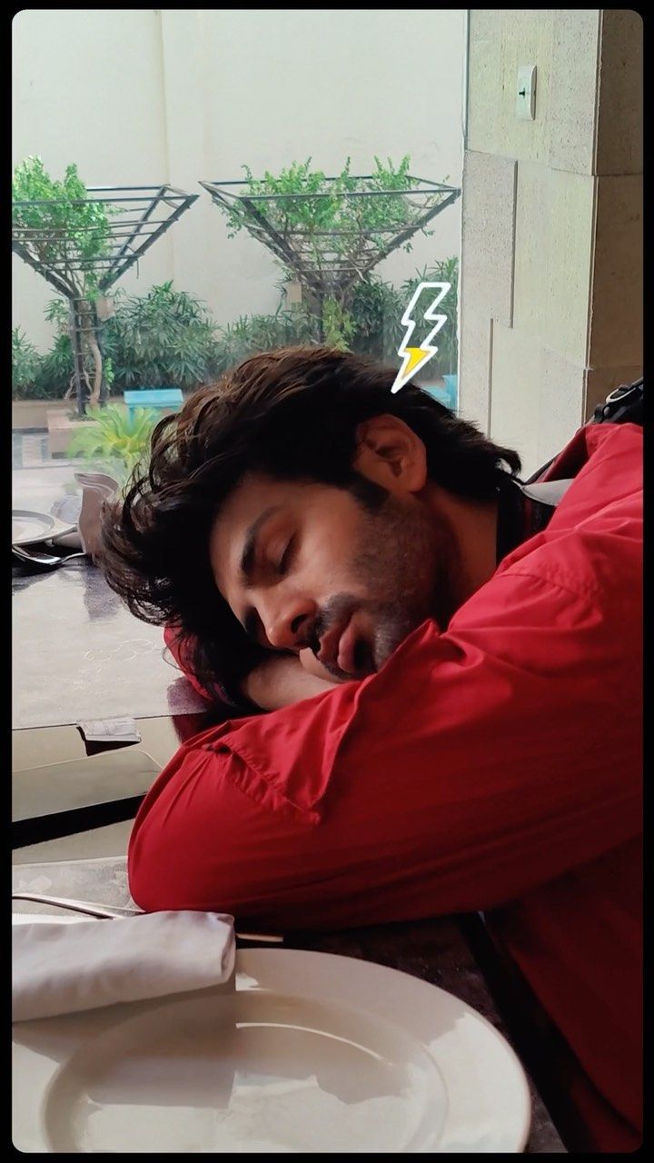 a man sleeping on top of a white plate