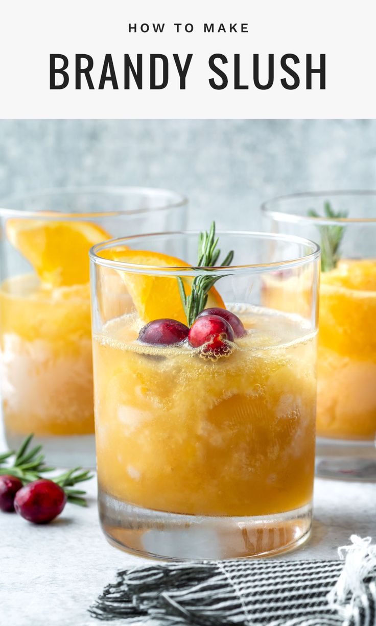 two glasses filled with brandy slush and garnished with cranberries on the side