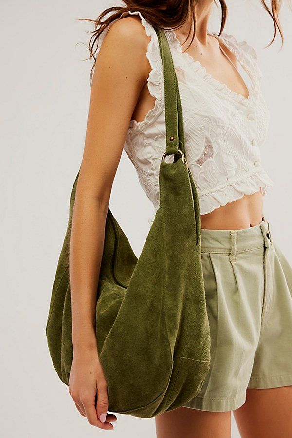 Effortlessly functional, this tote bag is featured in a slouchy hobo style with two elongated shoulder straps, all in soft suede fabrication with zipper closure for the perfect go-to bag. * Fully lined * Zipper closure * Fixed straps | Roma Suede Tote Bag by Free People in Green Slouchy Tote, Suede Tote Bag, Slouchy Bag, Slouch Bags, Everyday Tote Bag, Fall Bags, Suede Purse, Slouchy Style, Suede Tote