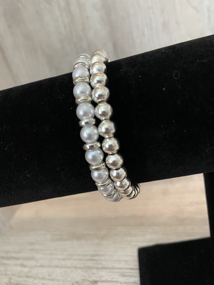 Pearl Bracelet Set (2 Separate Bracelets) Choose Gold or Silver (Silver Shown) Choose Size Standard Child 6 inches Standard Adult 6.75 inches (Sizing may vary slightly based on the nature of the items used) Elegant Silver Stackable Wrap Bracelet, Silver Stackable Pearl Bracelet With Round Beads, Silver Stackable Pearl Bracelet Gift, Elegant Silver Stackable Charm Bracelet, Silver Double Band Bracelets For Everyday, Elegant Silver Stretch Bracelet For Everyday, Silver Double Band Bracelet For Everyday, Everyday Silver Bead Stretch Bracelet, Adjustable Hypoallergenic Silver Stretch Bracelet