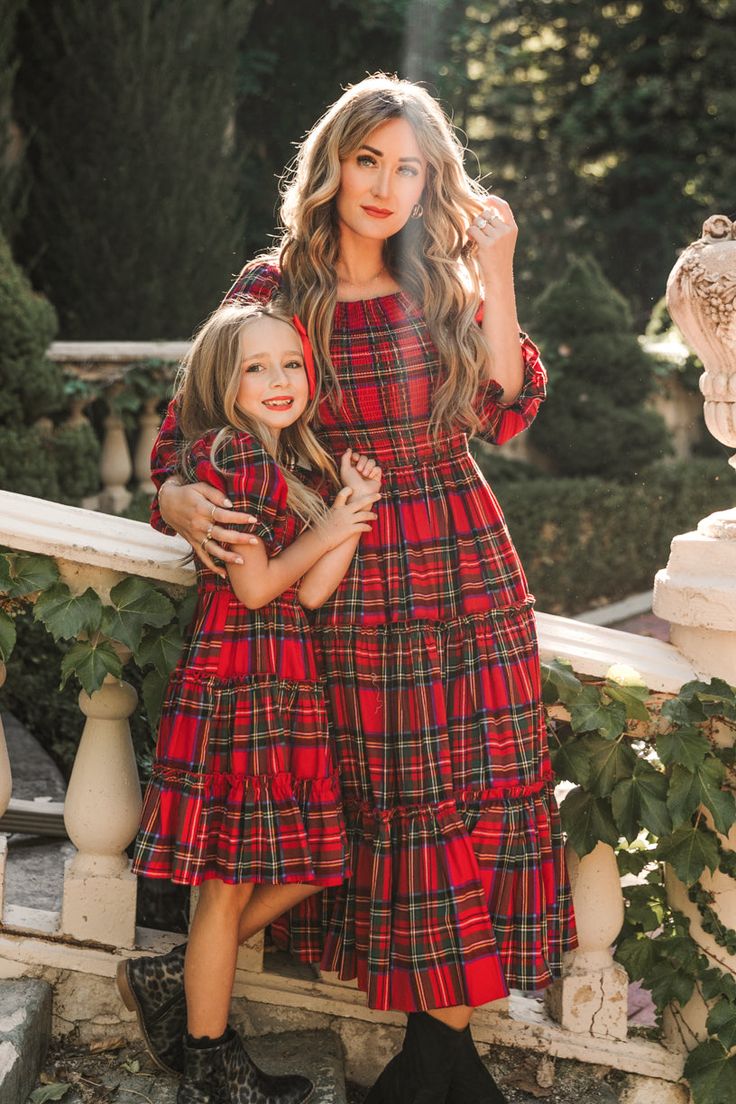 Flowy, darling, and winter princess approved. Everything this carefree midi-length girl's dress is made of. Inspired by holiday parties, family time, and playing with cousins or friends. Featuring a smocked bodice with puff sleeves, square neckline and ruffle detailing. Available for a limited time in our favorite festive print...HOLIDAY PLAID! Ivy City Co, Trendy Christmas Outfits, Winter Princess, City Woman, Holiday Plaid, Tiered Ruffle Skirt, Tea Length Dresses, African Attire, Style Mistakes