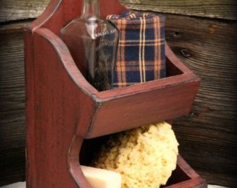 a wooden holder with soap and other items in it