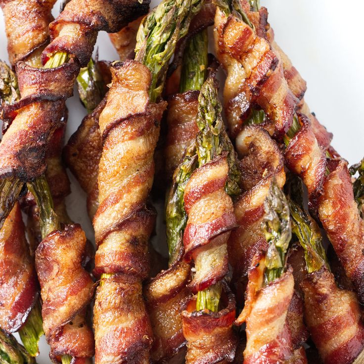 asparagus wrapped in bacon on a plate