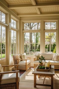 a sun room with couches, chairs and tables