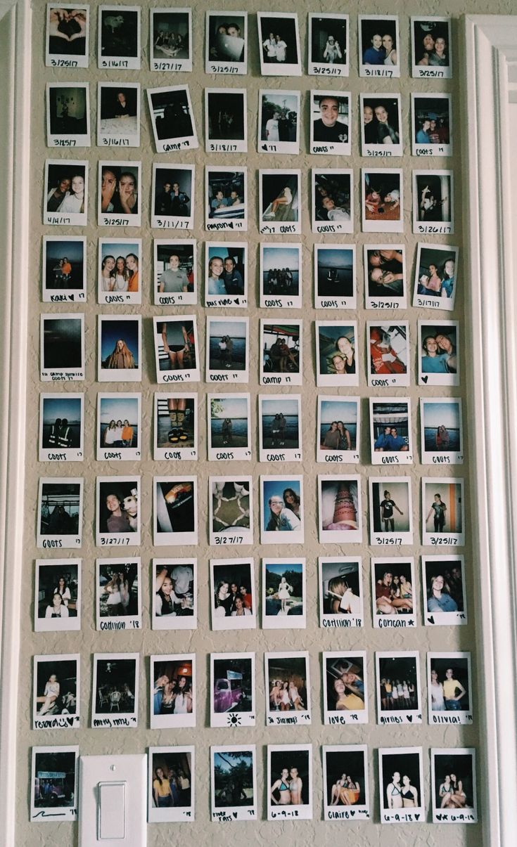 a wall covered in photos and magnets with pictures on it's back side