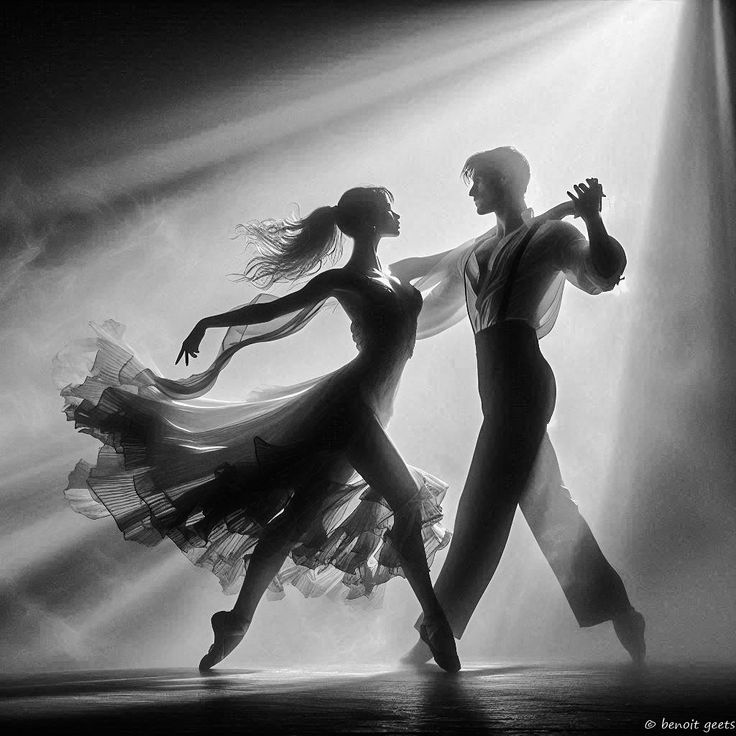 two people are dancing in the dark with light coming from behind them and their arms outstretched