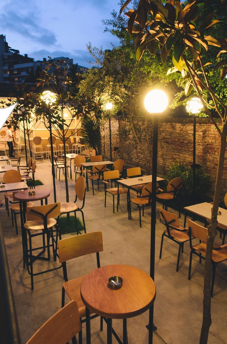 tables and chairs are lined up outside at night