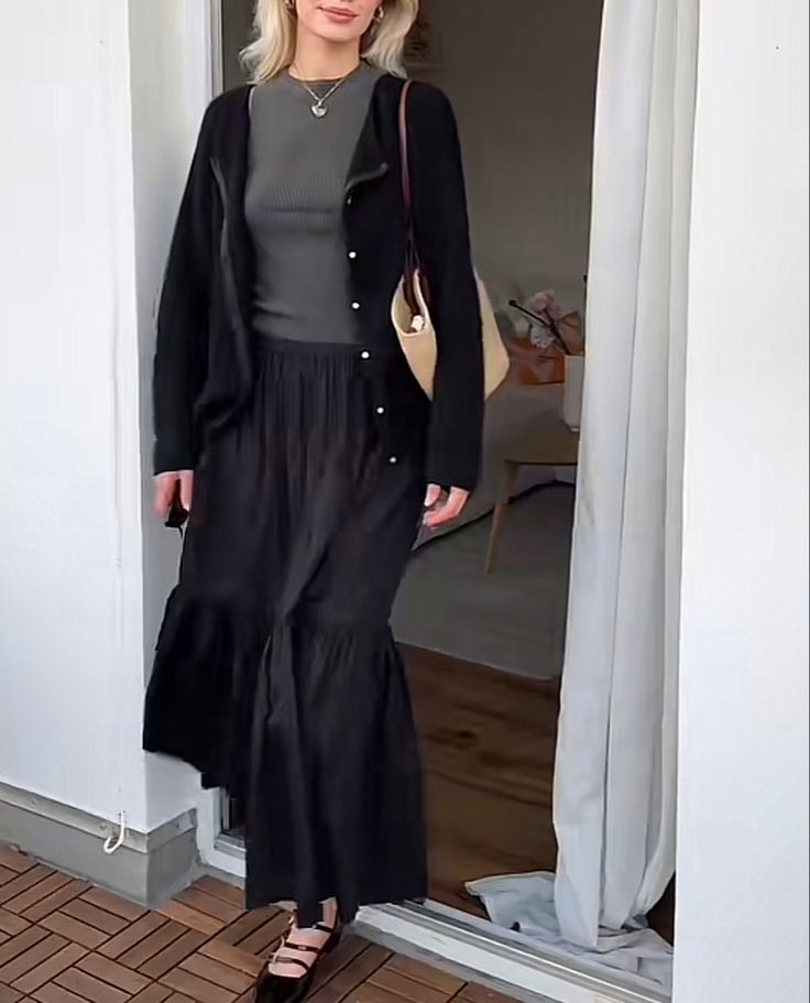 Fall Black Maxi Skirt Outfits, Tiered Maxi Skirt Outfit Winter, Tiered Black Skirt Outfit, Black Long Flowy Skirt Outfit, Black Maxi Skirt Outfit Spring, Flowy Winter Outfit, Long Black Tiered Skirt Outfit, Black Tiered Maxi Skirt Outfit, Midsize Maxi Skirt Outfit