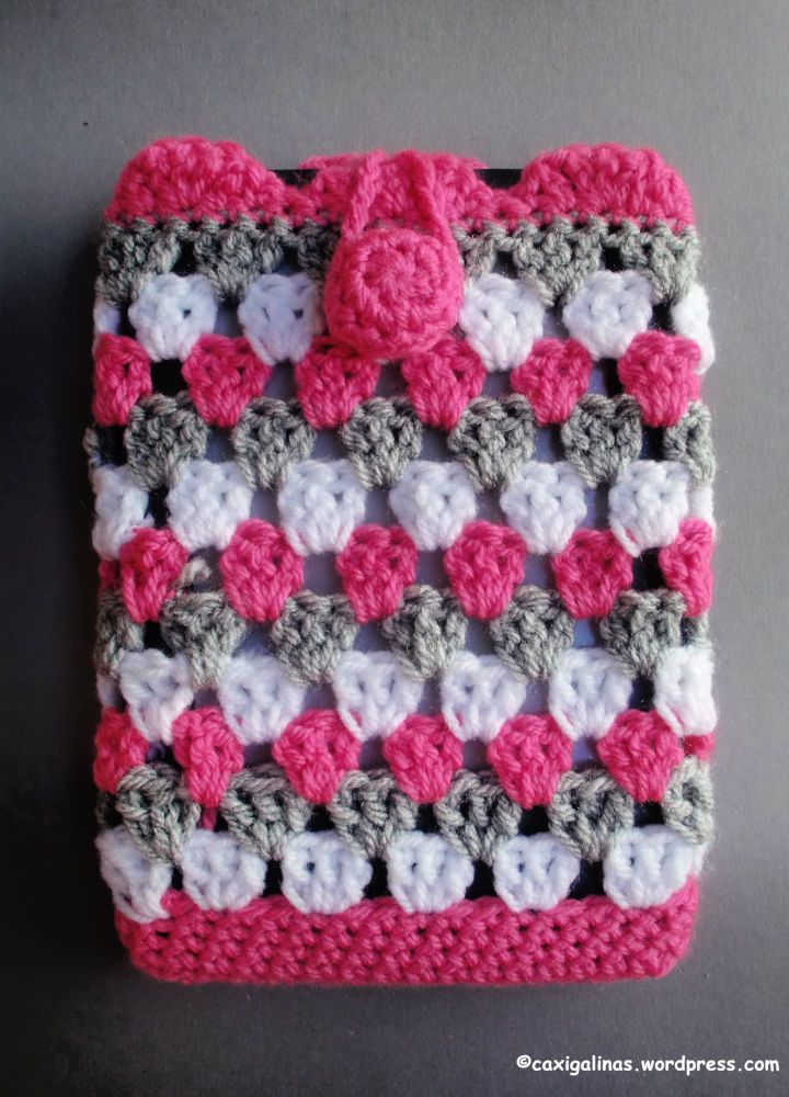 a crocheted square with hearts on it