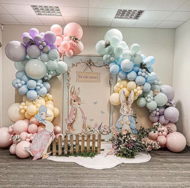 a room decorated with balloons and decorations