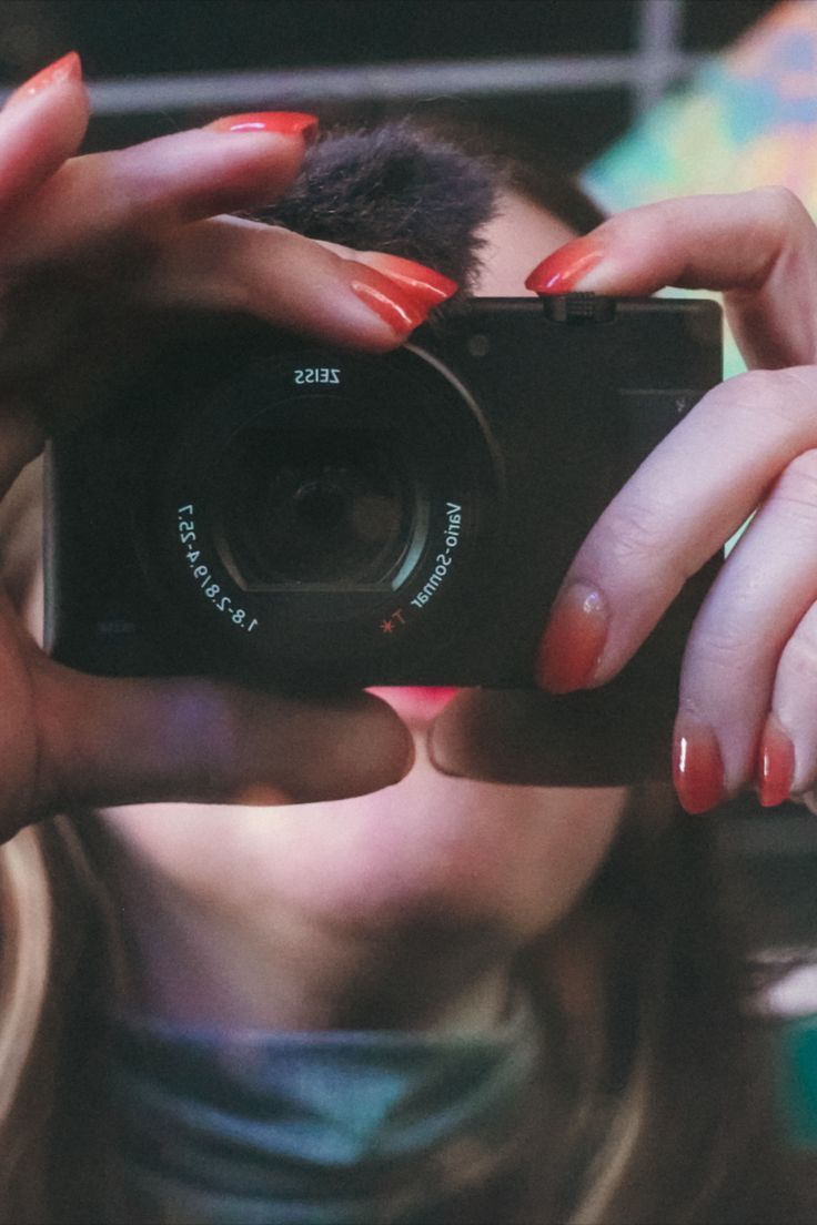 a woman taking a photo with her camera