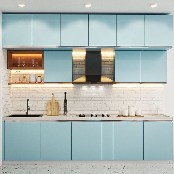 a kitchen with blue cabinets and white walls