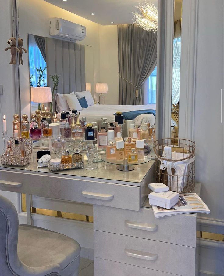 the vanity is full of perfumes and candles