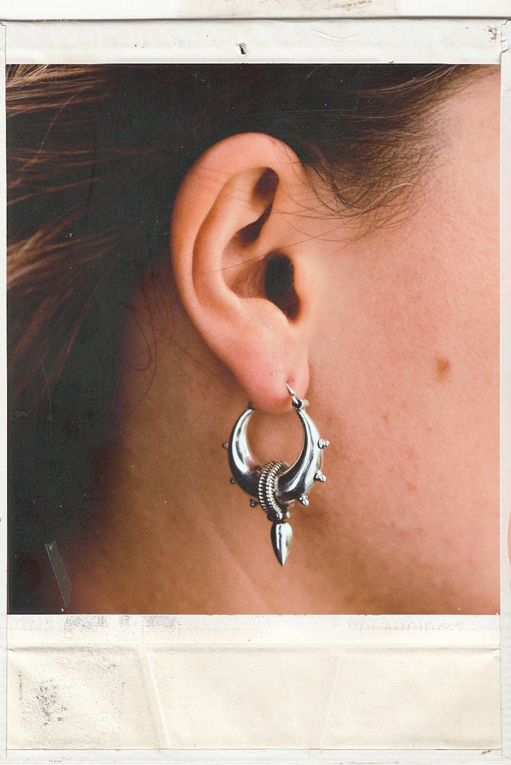 These beautiful hoops earrings have been made from sterling silver 92.5. The design is inspired from the tribes of bali. Size 2.5x3.5 cm  You can find other sizes of the design check here https://www.etsy.com/uk/listing/472999372/sterling-silver-tribal-hoop-earrings?click_key=578154921593086dc8ad8d96139568c22442ff48%3A472999372&click_sum=f50988f1&ref=shop_home_active_43&pro=1&frs=1 or in brass https://www.etsy.com/uk/listing/582515347/warrior-earrings-brass-tribal-hoops?ref=shop_home_active_55 A Bohemian Sterling Silver Pierced Hoop Earrings, Sterling Silver Bohemian Hoop Earrings, Silver Crescent Bohemian Hoop Earrings, Bohemian Sterling Silver Single Hoop Earring, Sterling Silver Pierced Hoop Earrings For Festivals, Unique Sterling Silver Hoop Earrings For Festivals, Bohemian Sterling Silver Crescent Hoop Earrings, Bohemian Crescent Hoop Earrings In Sterling Silver, Bohemian Crescent Sterling Silver Hoop Earrings