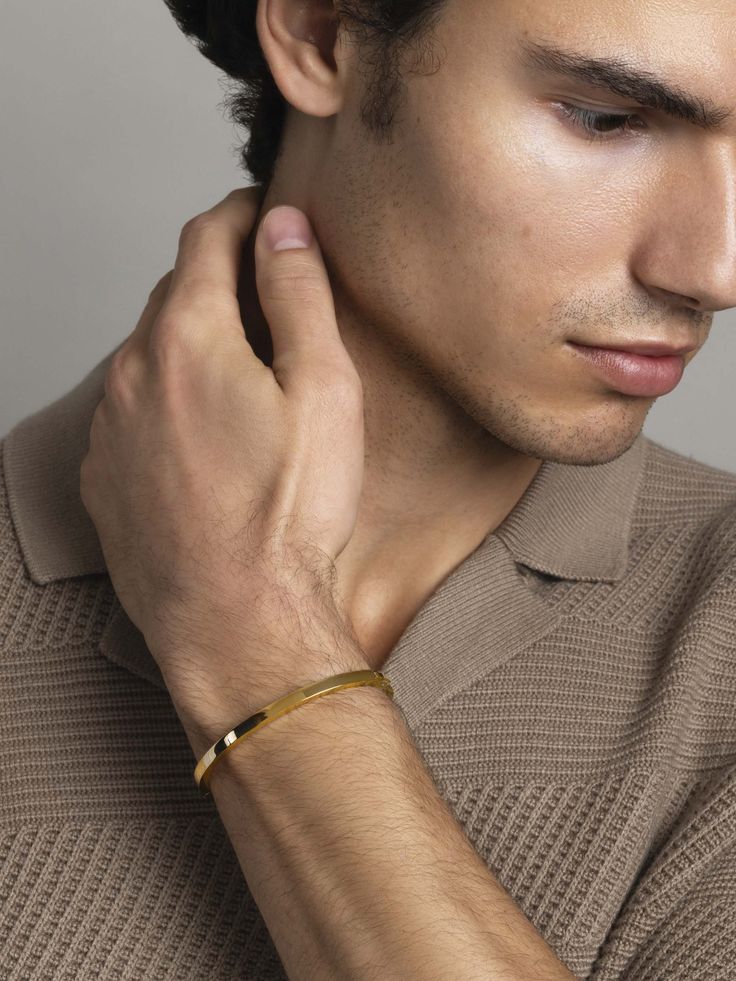 Bangle in Stainless Steel with Gold Plating Product code: MBANG_061 Designer's Notes This subtle, sleek bangle is an easy way to add an instant elegant touch to your look. Crafted from strong stainless steel with a lustrous gold finish, this timeless everyday piece can be worn solo or opposite your favorite watch. Bangle For Men Gold, Kada Bangles Gold Design Men, Men Gold Bangle Design, Mens Bangles Gold For Men, Bracelets Men Gold, Mens Bracelet Designs Gold, Gents Bangle Gold, Bracelets Gold For Men, Gold Bracelet Designs For Men