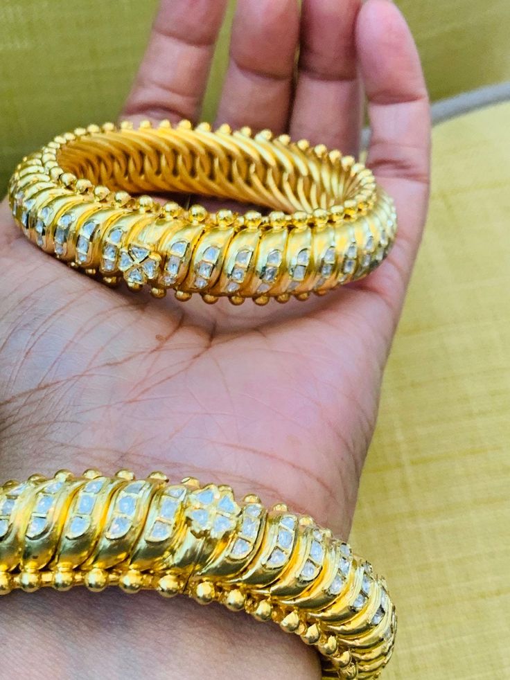 18k Gold Bangle Pair with genuine diamonds Price $5300 22k Gold Bangle Pair with genuine diamonds Price $7000 Watch the video here https://www.youtube.com/watch?v=aipZg8AB_q0 What's app / Call +1-714-924-2732 for any questions or email indianjewellery@hotmail.com Luxury Yellow Gold Collectible Bangle, Luxury 22k Gold Hand Set Bangle, Luxury Gold-tone Bangle, Luxury Gold-tone Bangle With Polished Finish, Luxury 22k Gold Hand-set Bangle, 22k Gold Bangles, Tsavorite Ring, 18k Gold Bangle, Sapphire And Diamond Earrings