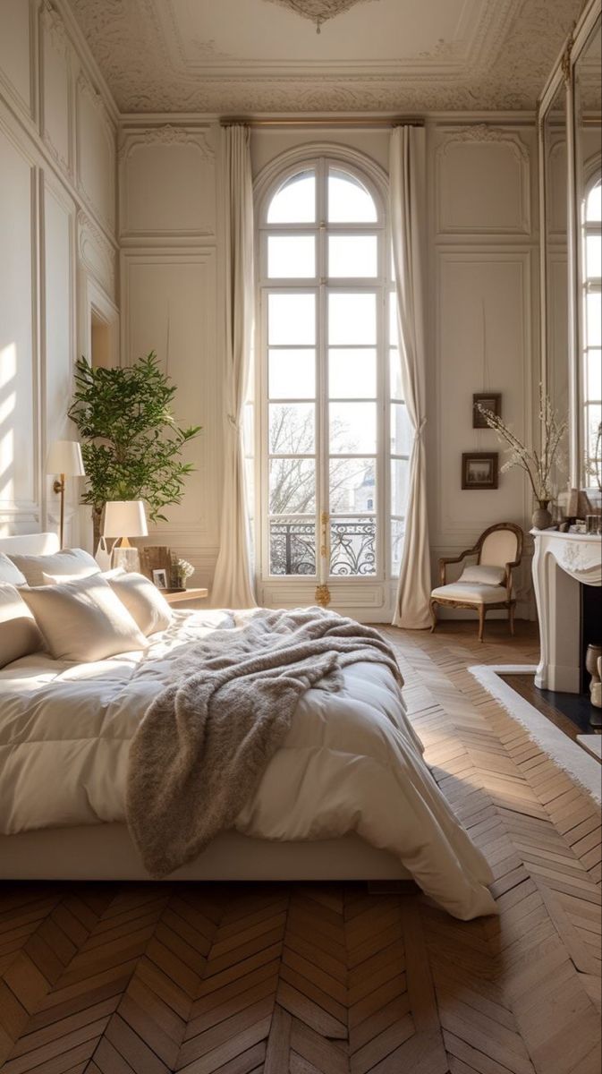 a large bed sitting in the middle of a bedroom